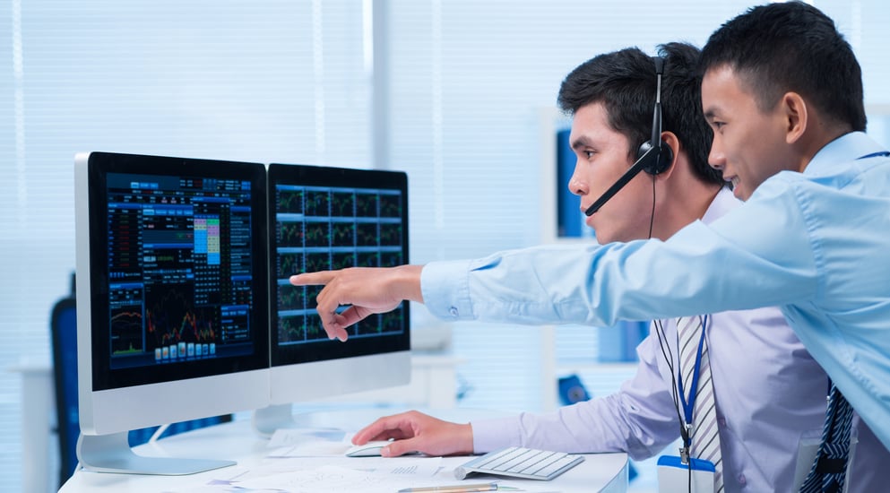 Investors at a computer